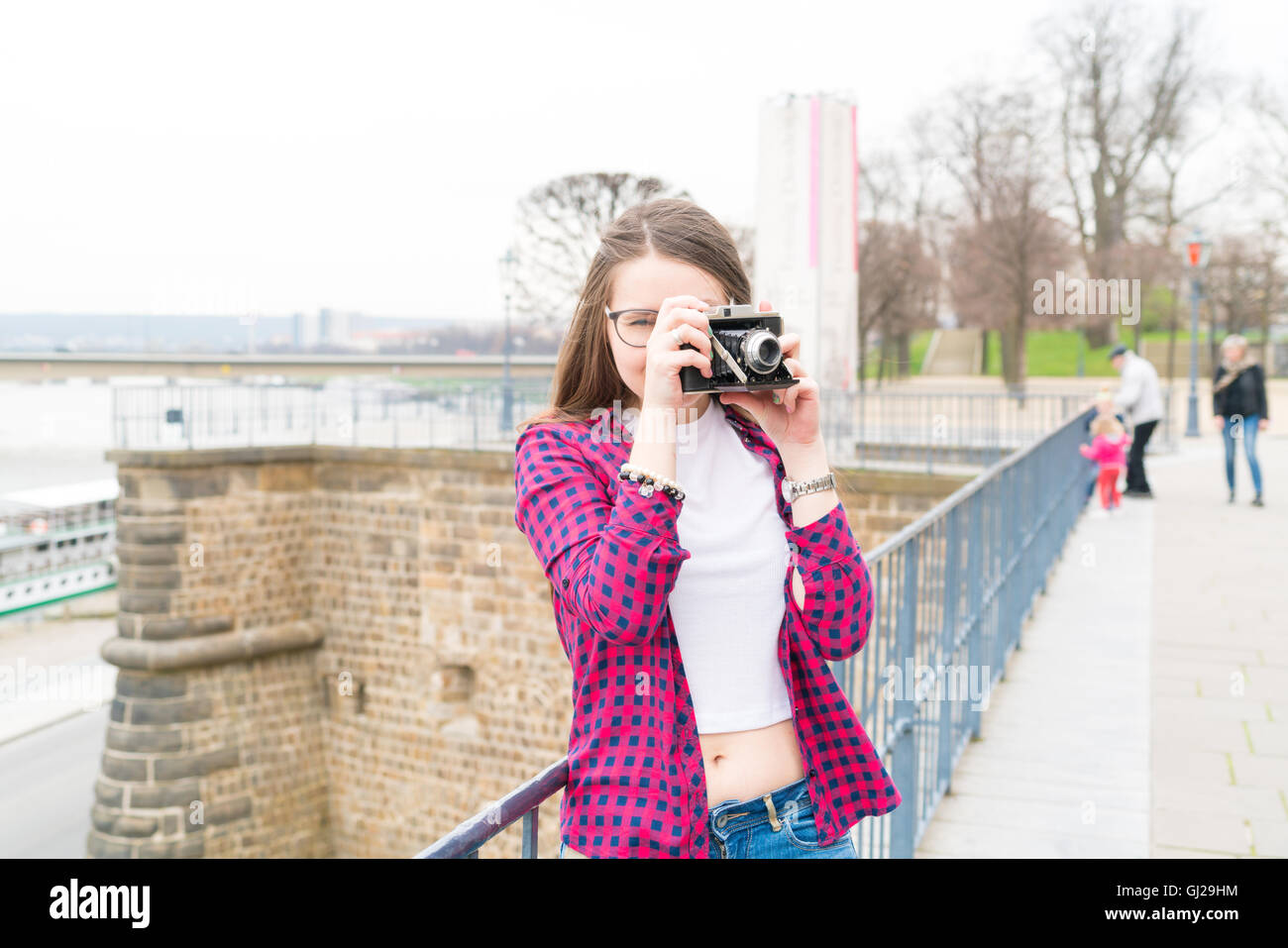 Woman tourist photographed retro camera historic part of the city, Dresden, Germany Stock Photo