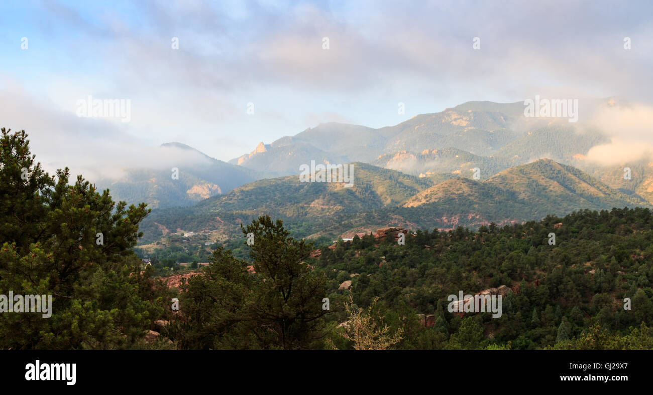 Pike's Peak in morning light and clearing fog. Stock Photo