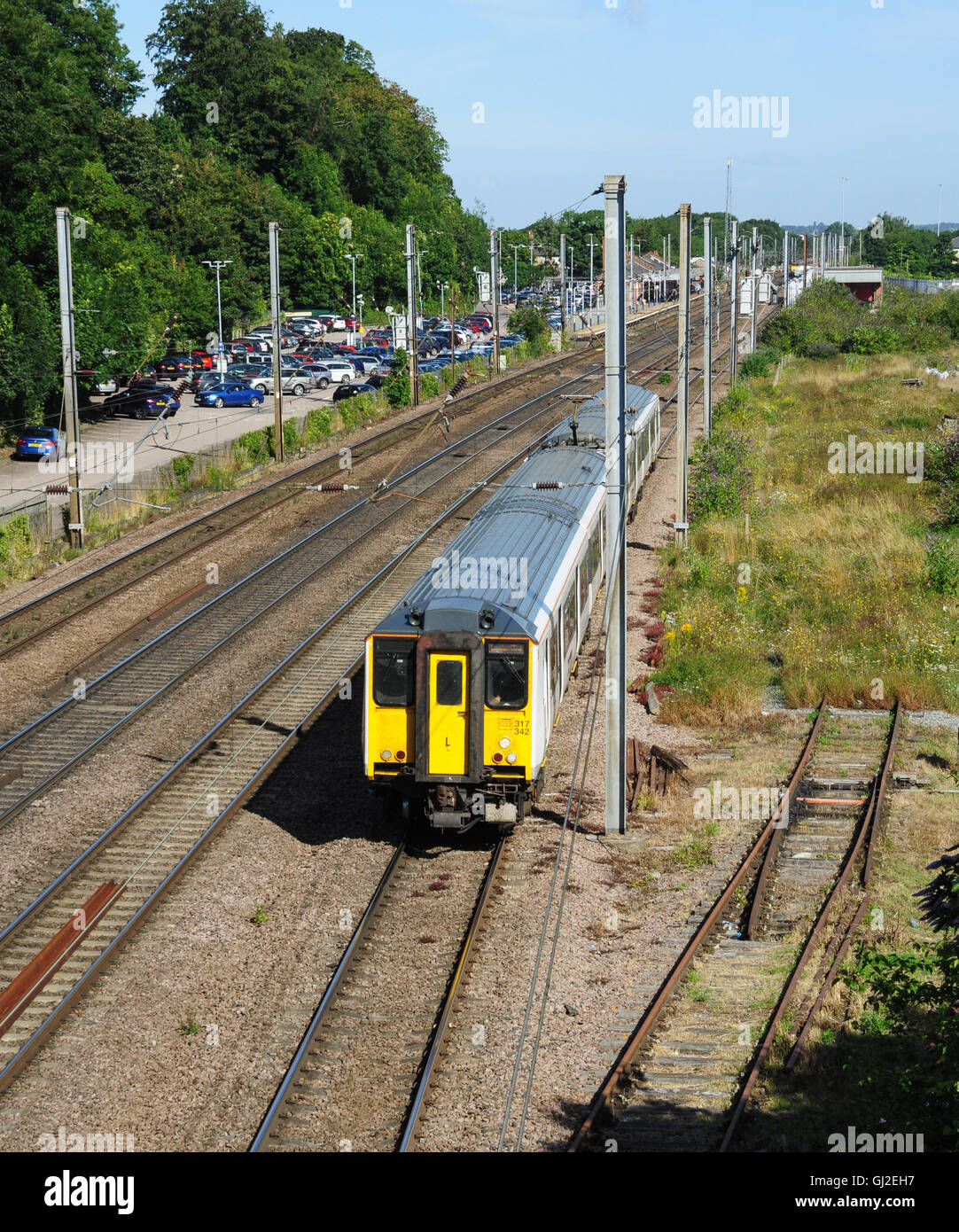 Class 317 EMU commuter train, bound for London, heads south from Hitchin, Hertfordshire, England