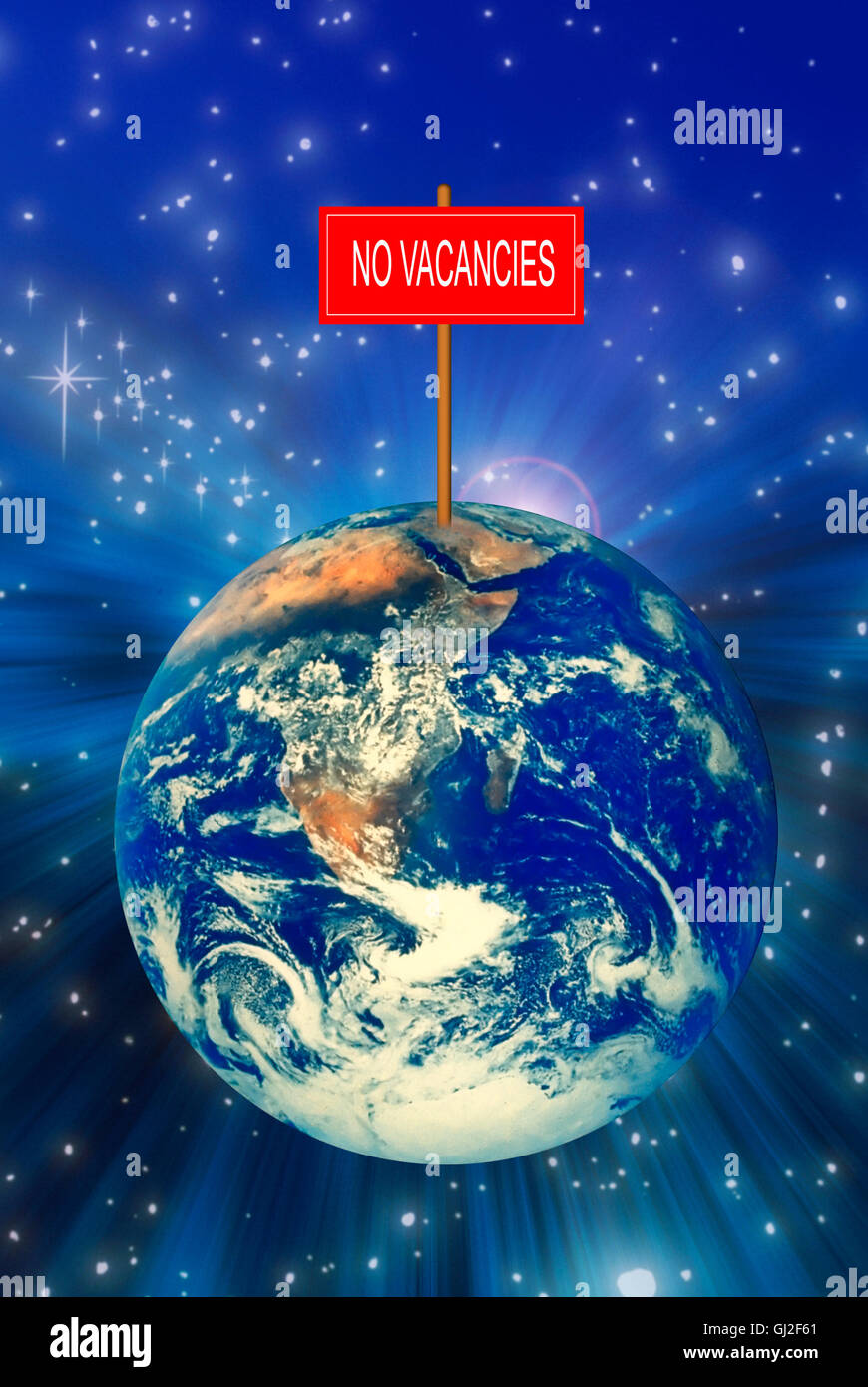 earth overpopulation concept - planet earth with a NO VACANCIES sign on top of it Stock Photo