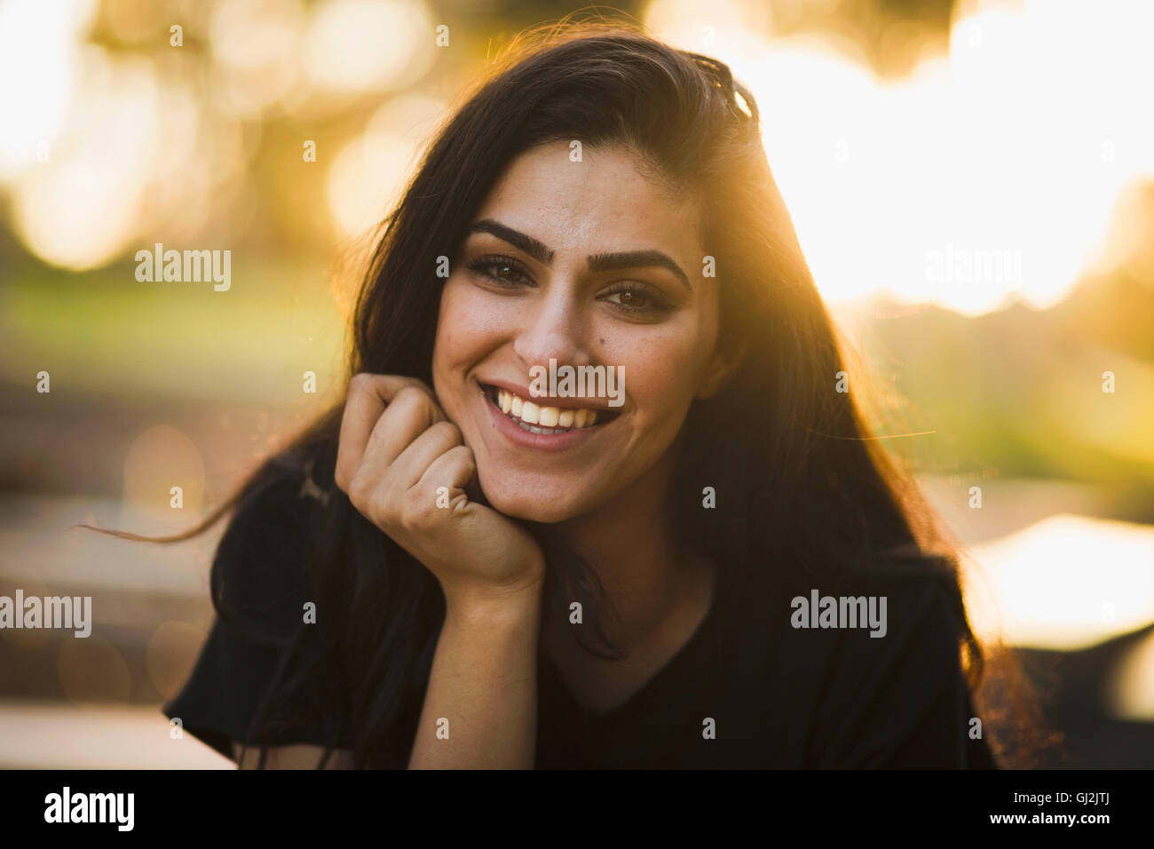 Portrait of young woman, outdoors, smiling Stock Photo - Alamy