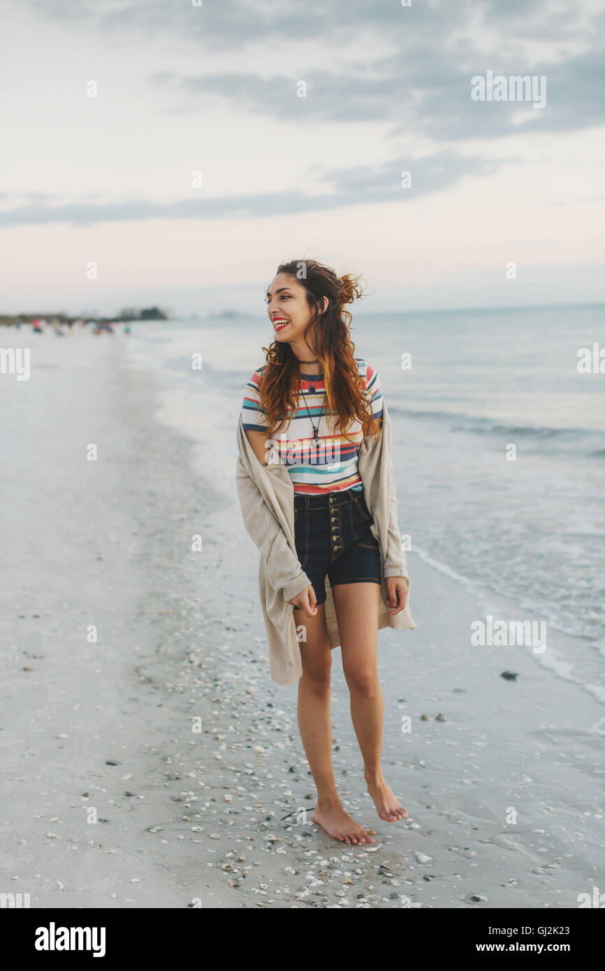 Happy woman on beach Stock Photo - Alamy