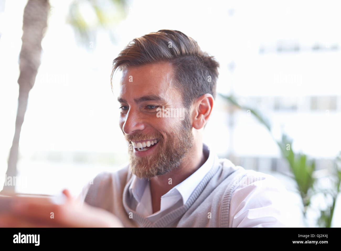 Laughing man sitting hi-res stock photography and images - Alamy