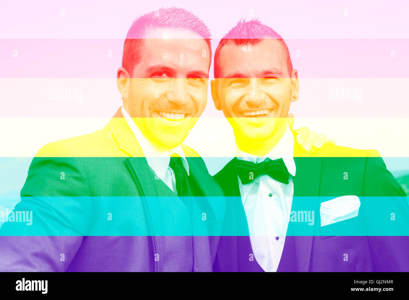 A Portrait of a loving gay male couple on their wedding day with sky on the back. Stock Photo