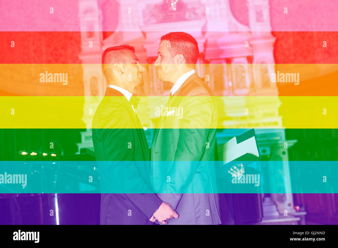 A Portrait of a loving gay male couple on their wedding day inside the church. Stock Photo