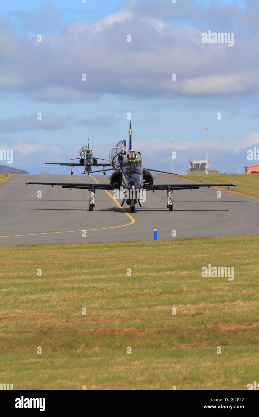 Royal Air Force Hawk jet trainers taxiying to the runway at RAF Valley. Stock Photo