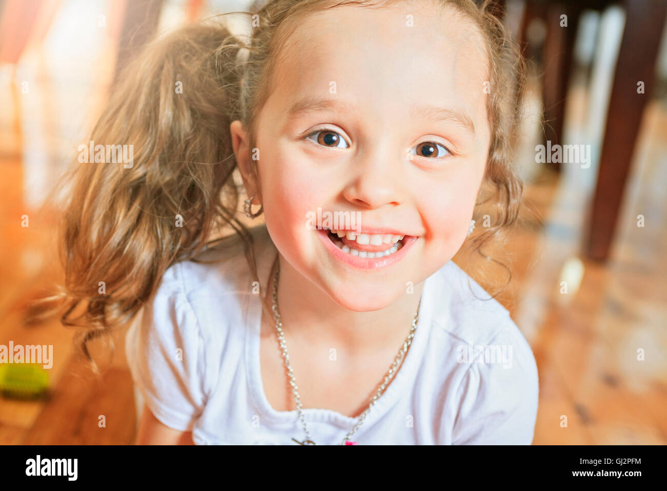 A Three Year Old Cute Girl Playing With Connecting Blocks Stock Photo