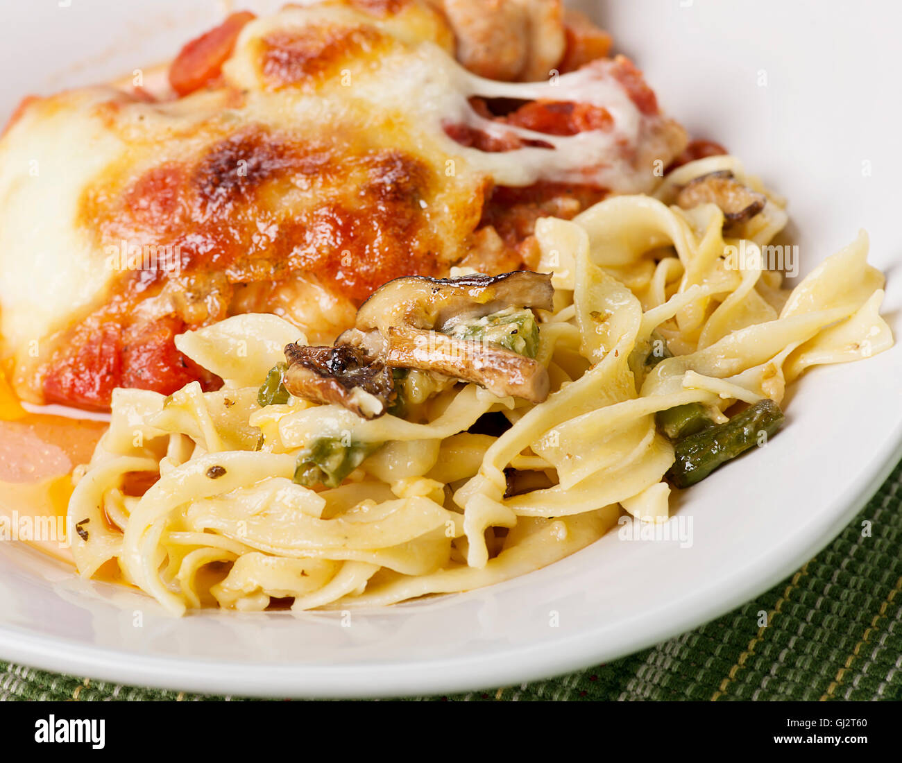 Pasta with Green Beans and Mushrooms and Parmesan Chicken Stock Photo