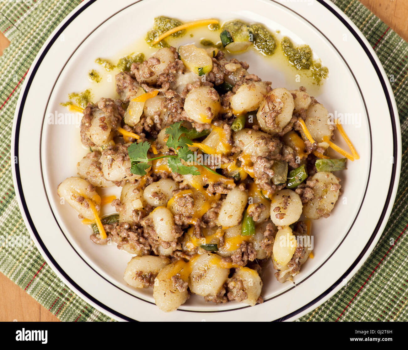 Potato gnocchi, Italian potato dumplings with ground beef ,green beans and cheese Stock Photo