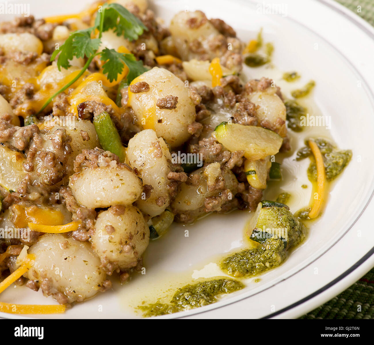 Potato gnocchi, Italian potato dumplings with ground beef ,green beans and cheese Stock Photo
