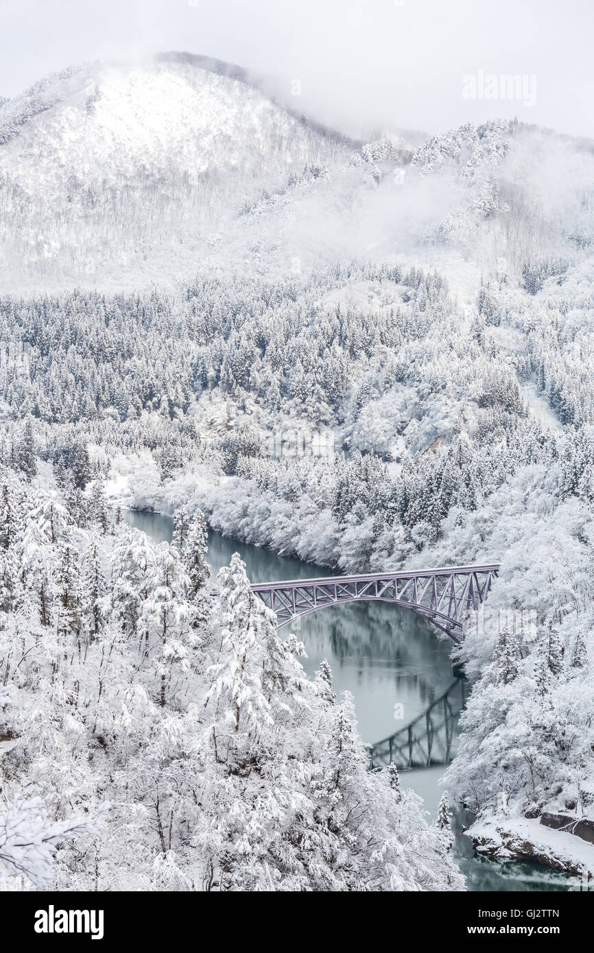 Winter landscape snow covered trees with River and Bridge Stock Photo ...