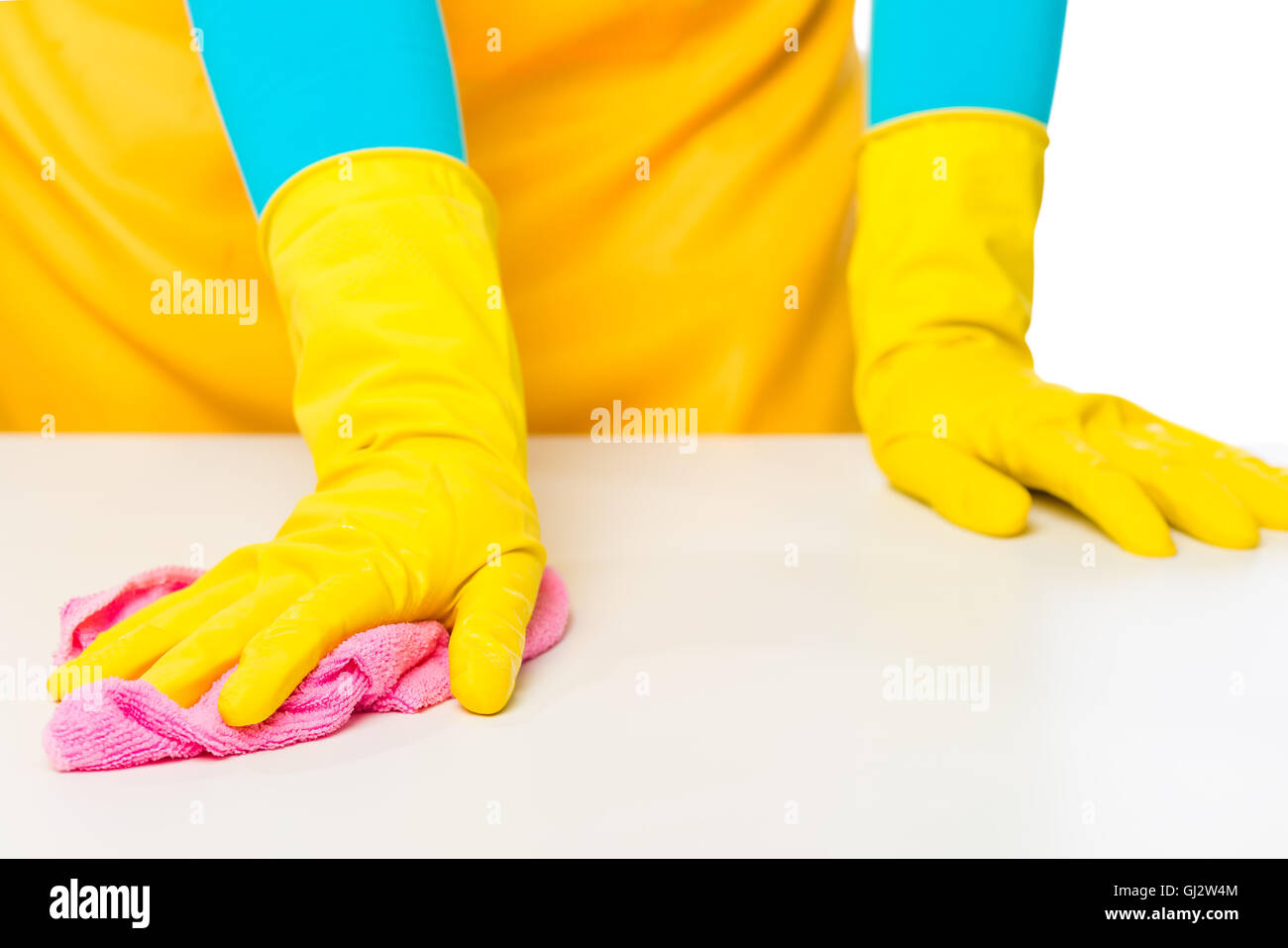 housewife rubbing white table a rag made of microfiber, hands close-up ...