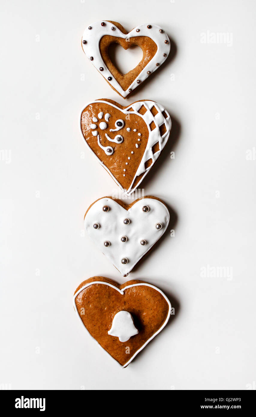 Row of heart-shaped gingerbread on white background Stock Photo - Alamy