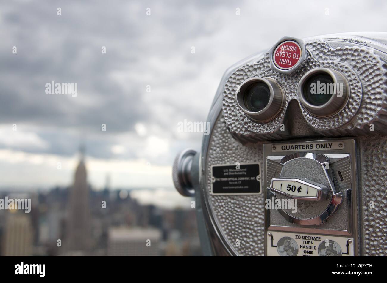 Coin operated binoculars with Empire State Building in background, New York, New York State, USA