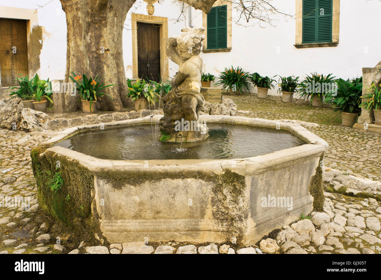 Water fountain in a court yard Stock Photo