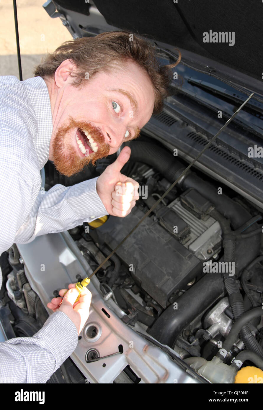 checking engine oil dipstick Stock Photo Alamy