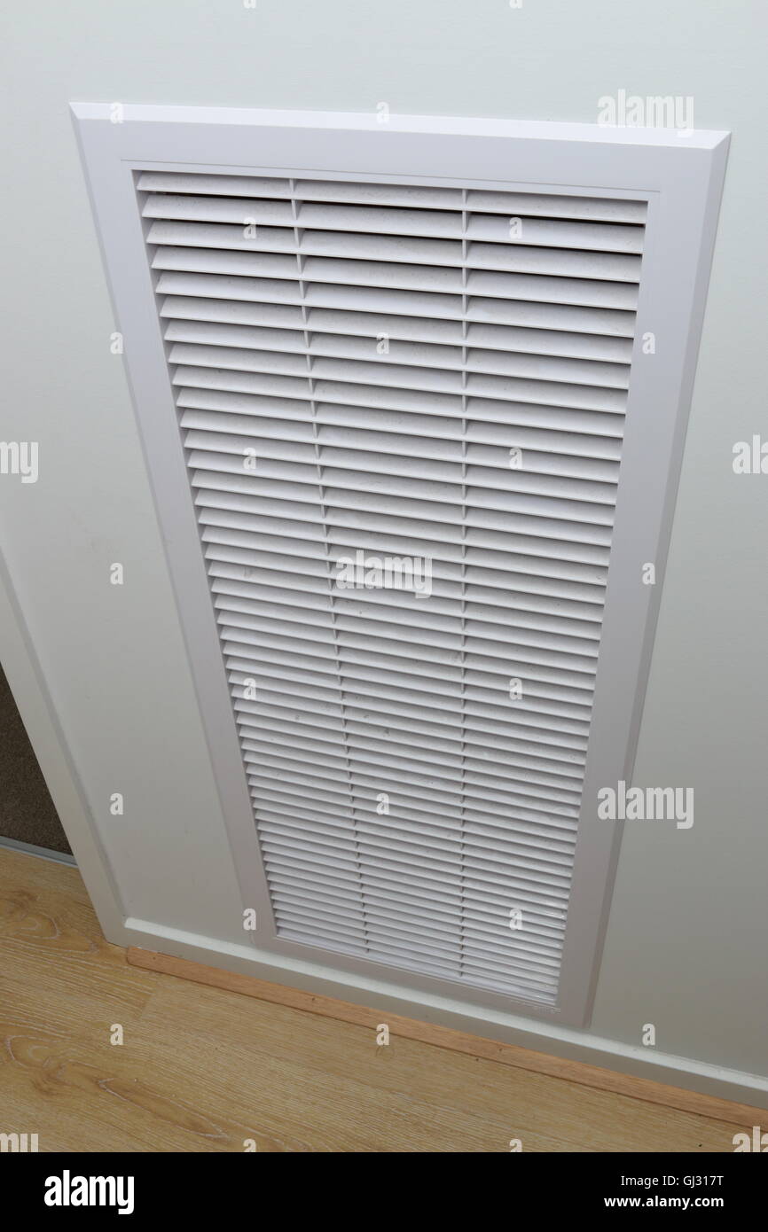 Residential ducted heating and cooler air ventilation intake filter on white wall in Melbourne Victoria Australia Stock Photo