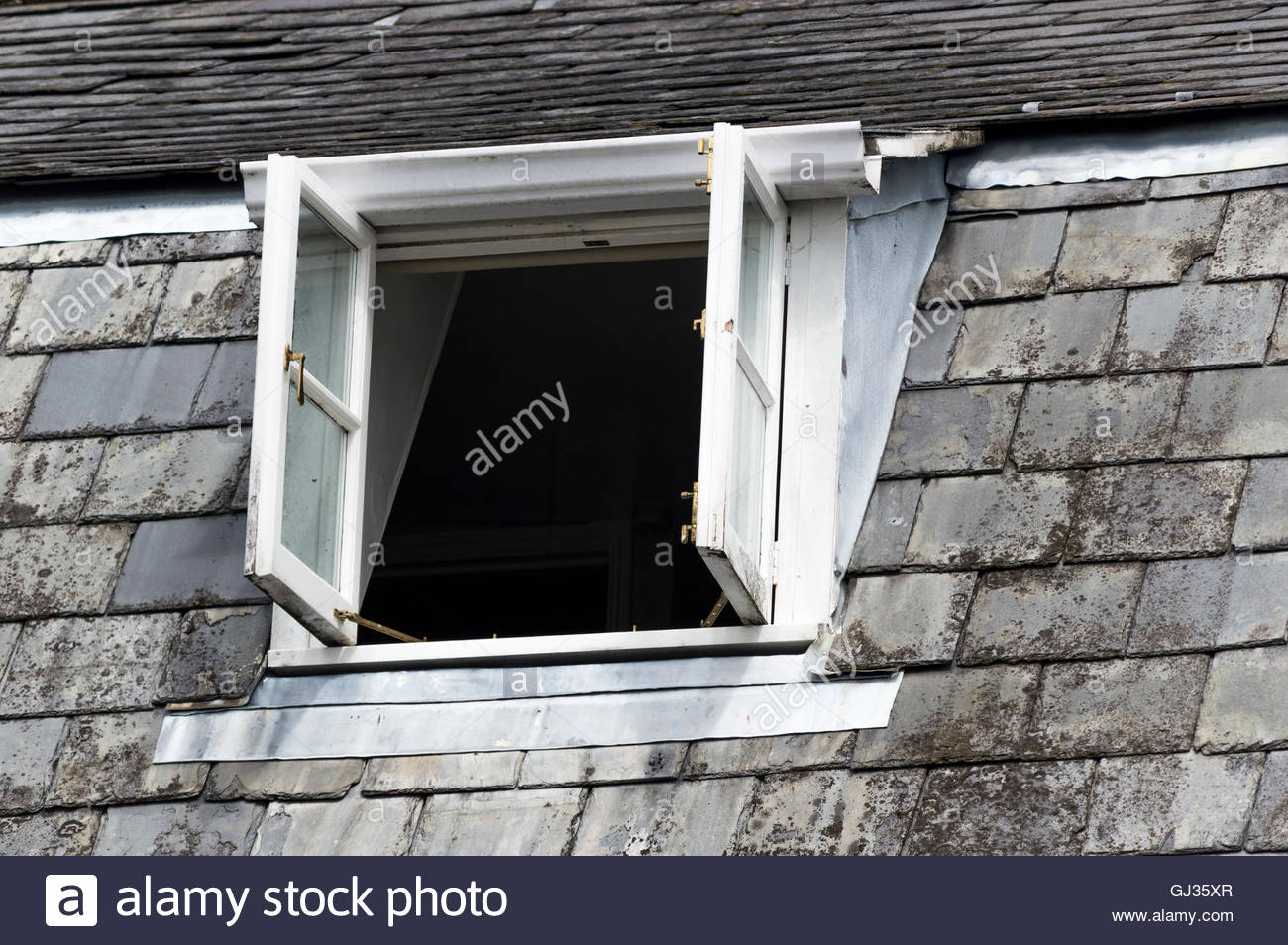 Looking Up At The Open Shed Style Dormer Window Of An Old House