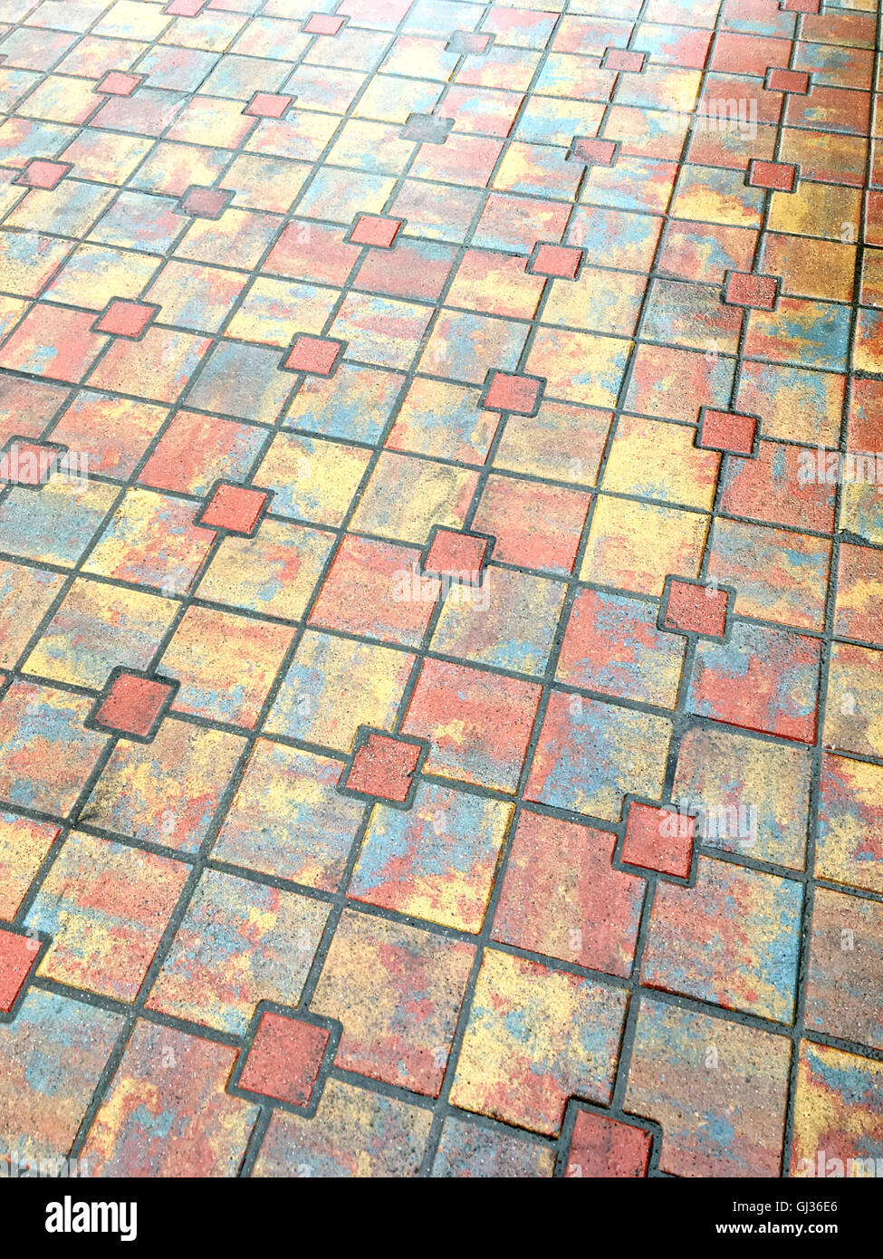 wet different colored concrete bricks pavement background Stock Photo