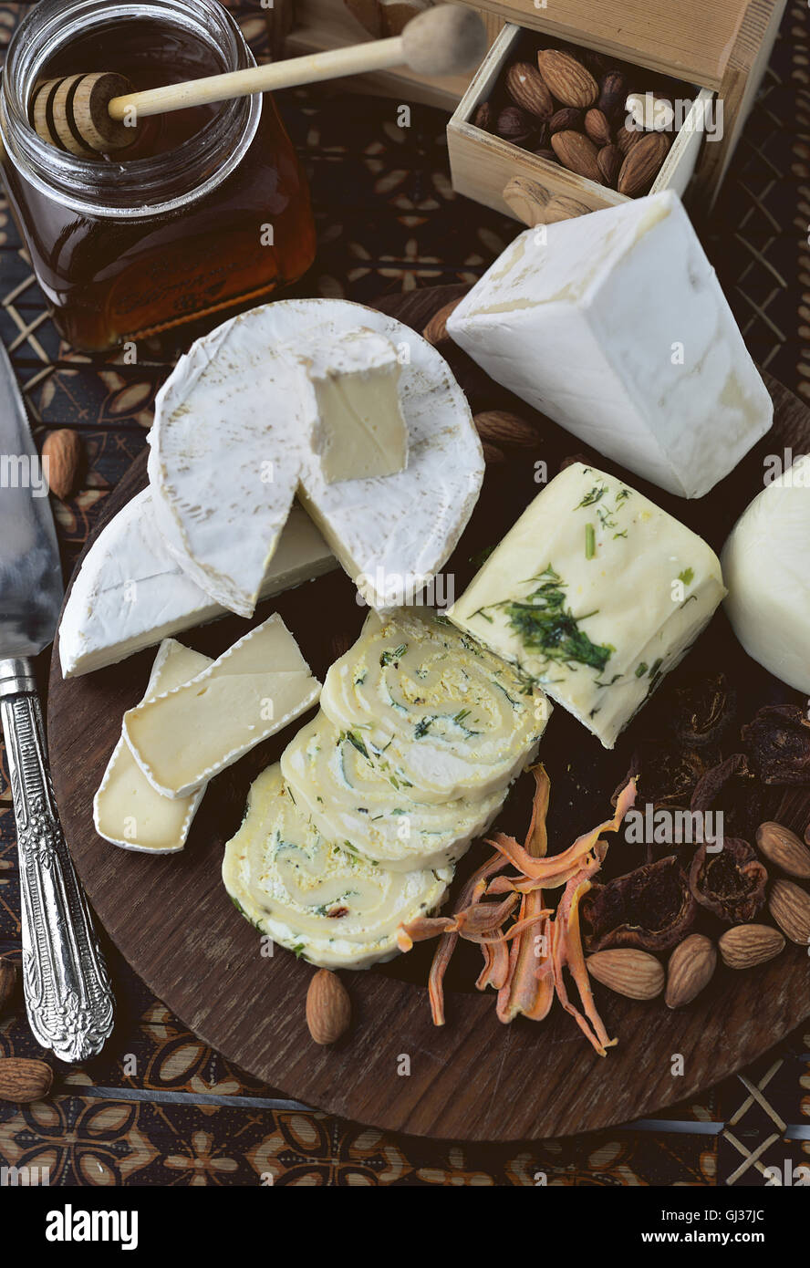 Cheese platter with assorted cheese and nuts Stock Photo Alamy