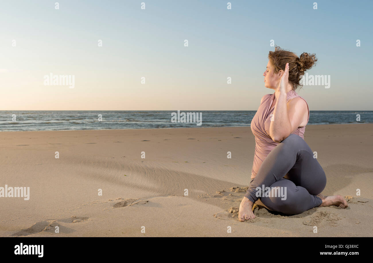 Mature woman beach sitting hi-res stock photography and images - Alamy
