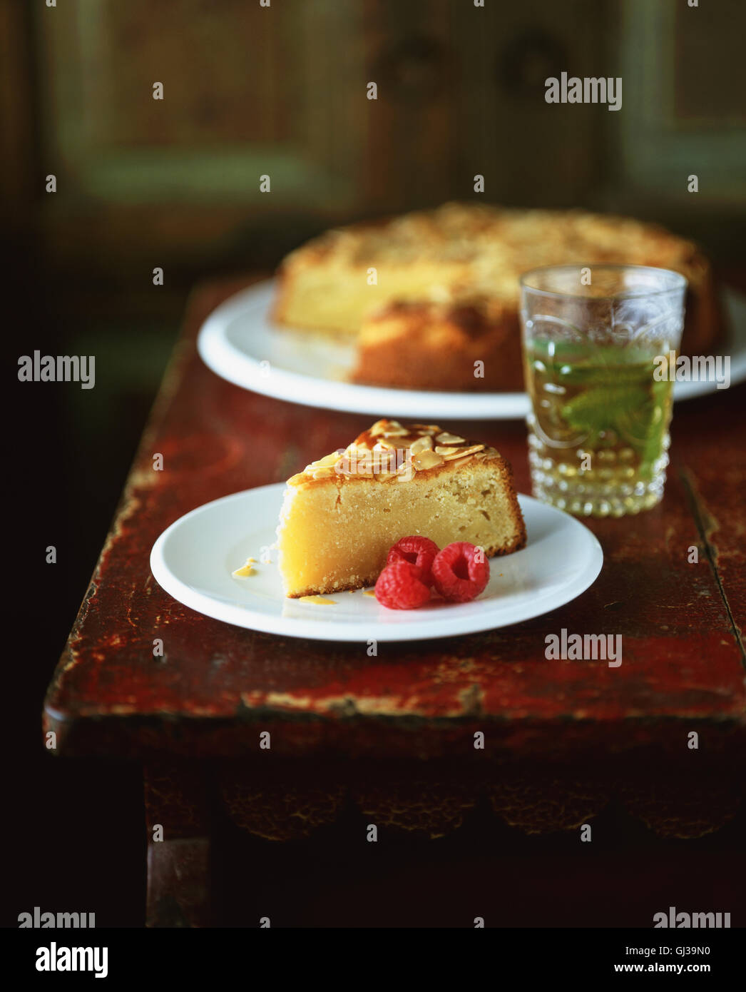 Slice of almond polenta cake with raspberries Stock Photo