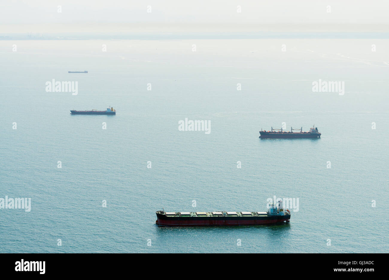 Aerial shot of ships moored off the Dutch coast, IJmuiden, North Holland, Netherlands Stock Photo