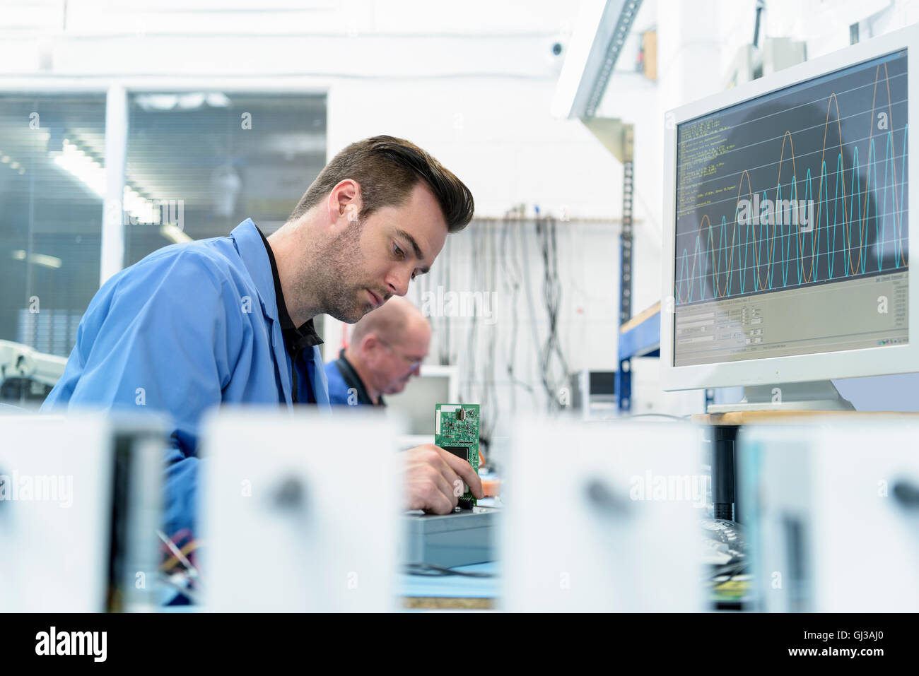 Component testing in circuit board assembly factory Stock Photo