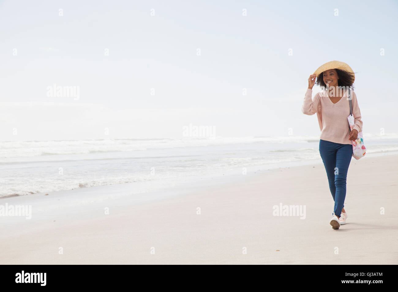 Woman hat on sandy beach hi-res stock photography and images - Alamy