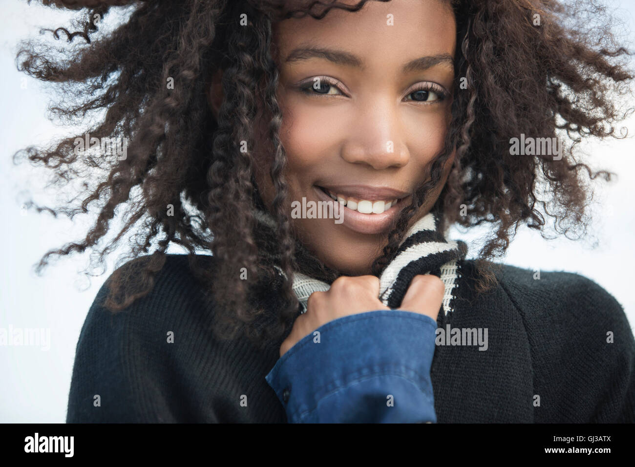 Young woman feeling cold in wind Stock Photo