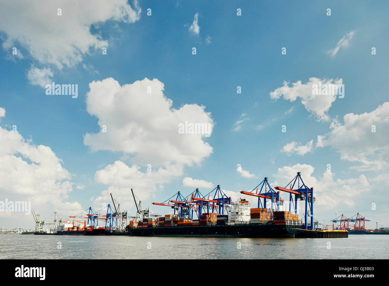 Row of loading cranes on river Elbe, Port of Hamburg, Germany Stock Photo