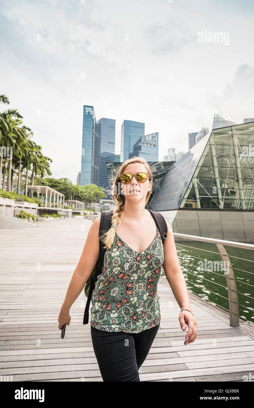 Tourist sightseeing, Singapore skyline, Marina Bay in background Stock Photo