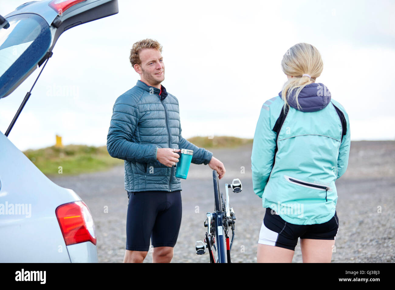 Cyclists chatting before ride Stock Photo