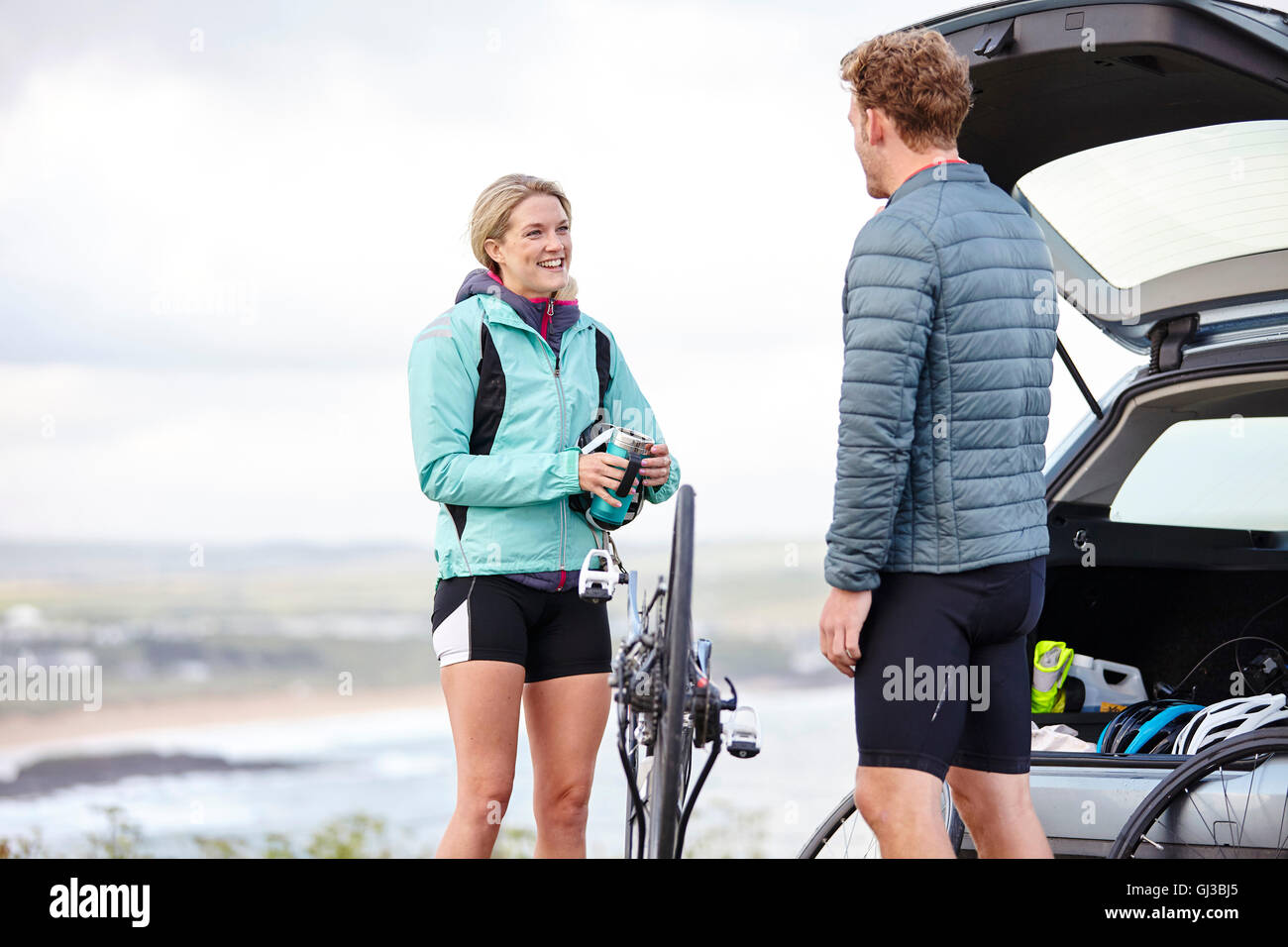 Cyclists preparing bicycle for ride Stock Photo