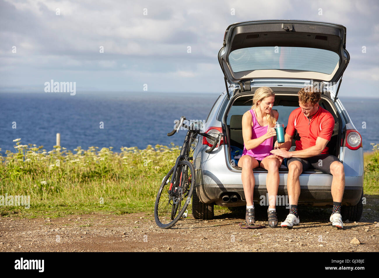 Cyclists preparing for ride Stock Photo