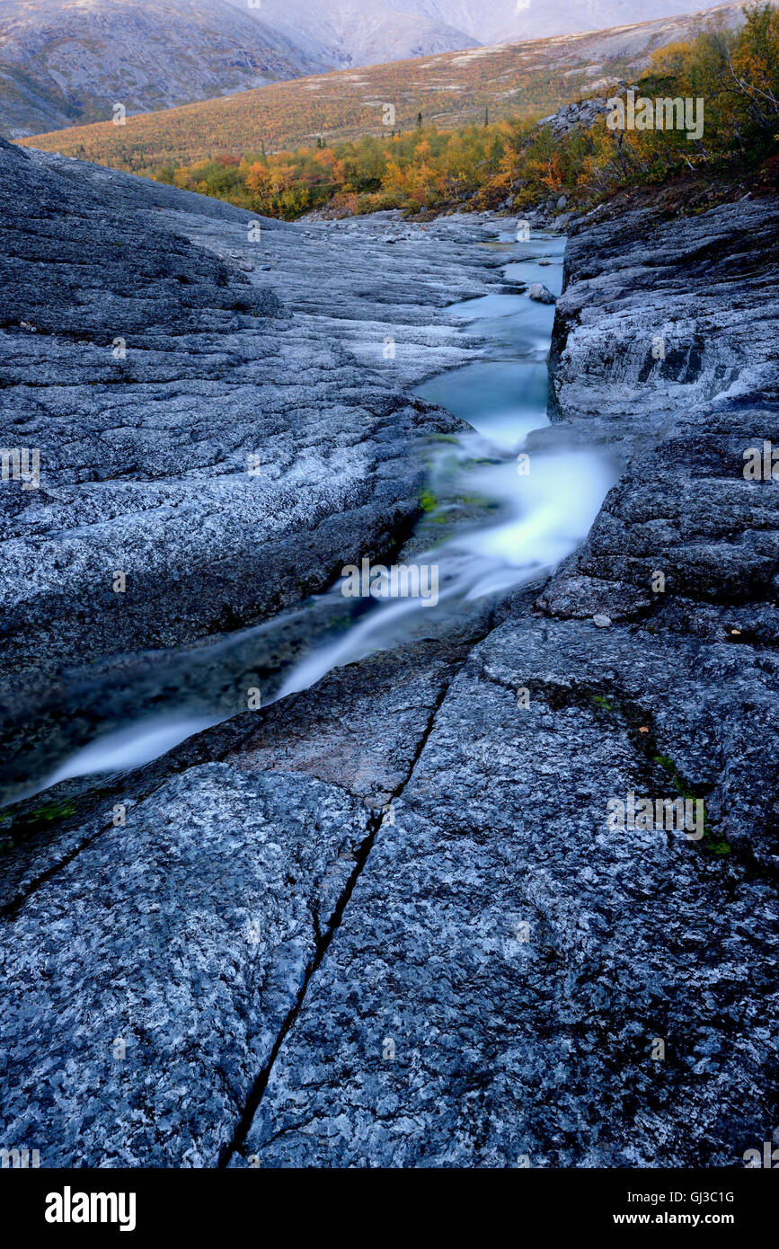Stream flowing through rock gorge, Khibiny mountains, Kola Peninsula, Russia Stock Photo