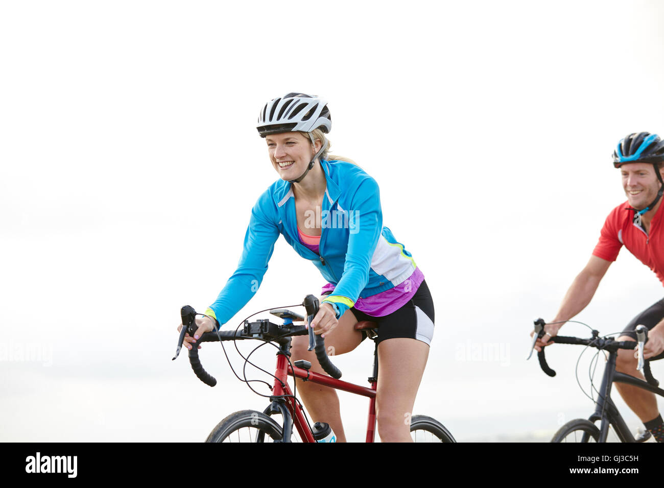 Happy cyclists riding on sunny day Stock Photo
