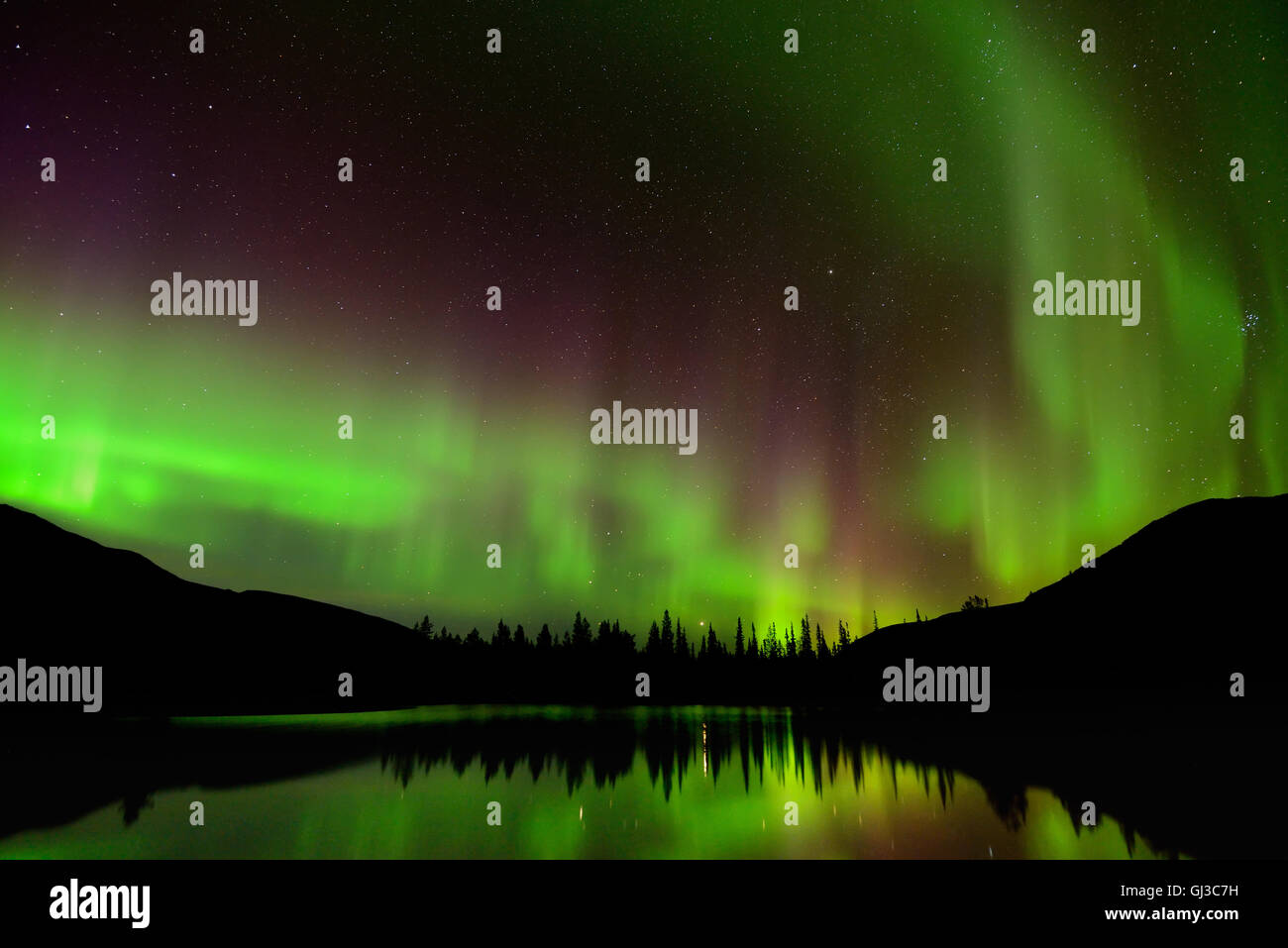 Green aurora borealis at Polygonal Lakes at night, Khibiny mountains, Kola Peninsula, Russia Stock Photo