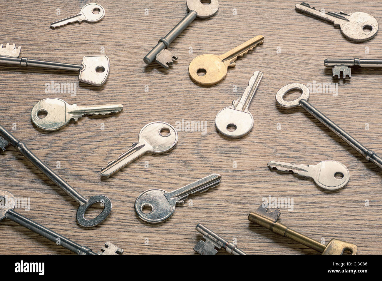 Keys on wooden surface Stock Photo
