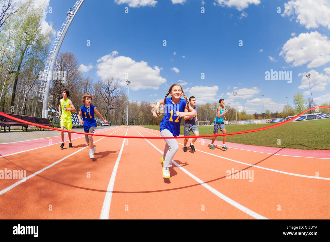 Young sprinters running to the finish line Stock Photo Alamy