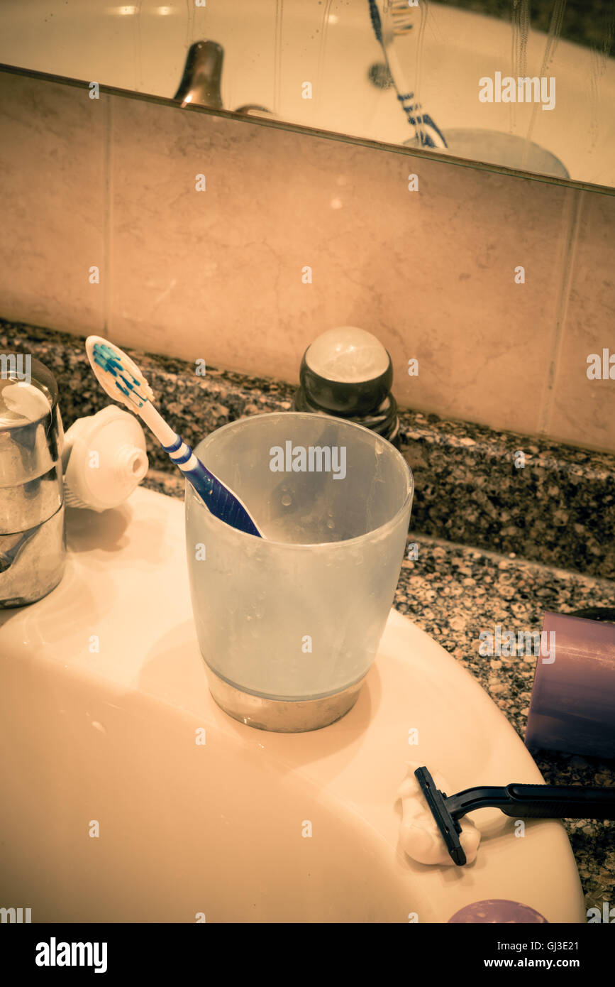 Bathroom sink in messy condition, a single male lifestyle concept Stock Photo