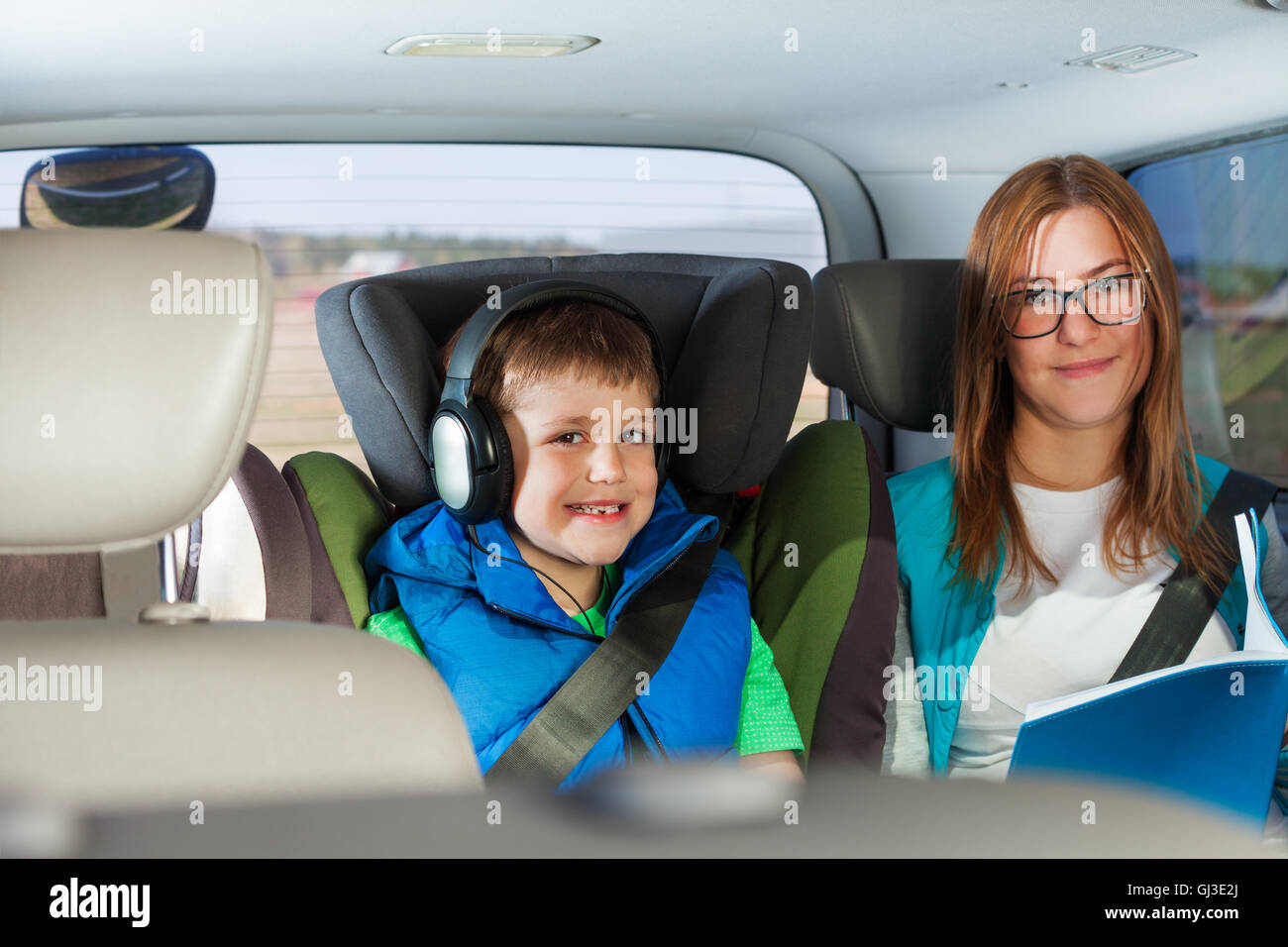 Portrait of happy passengers sitting in the car Stock Photo Alamy