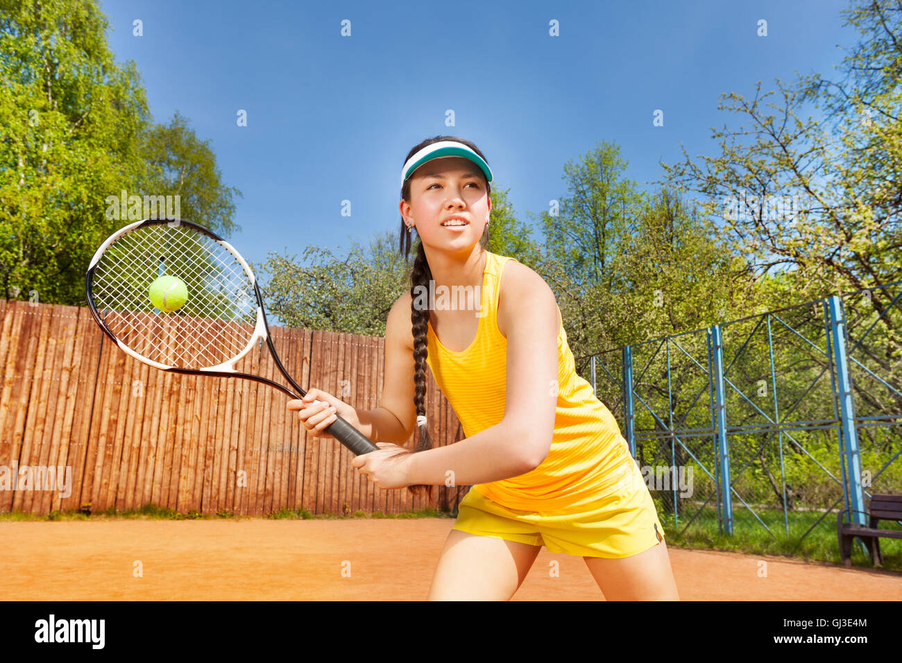 Female tennis player in action outdoor Stock Photo