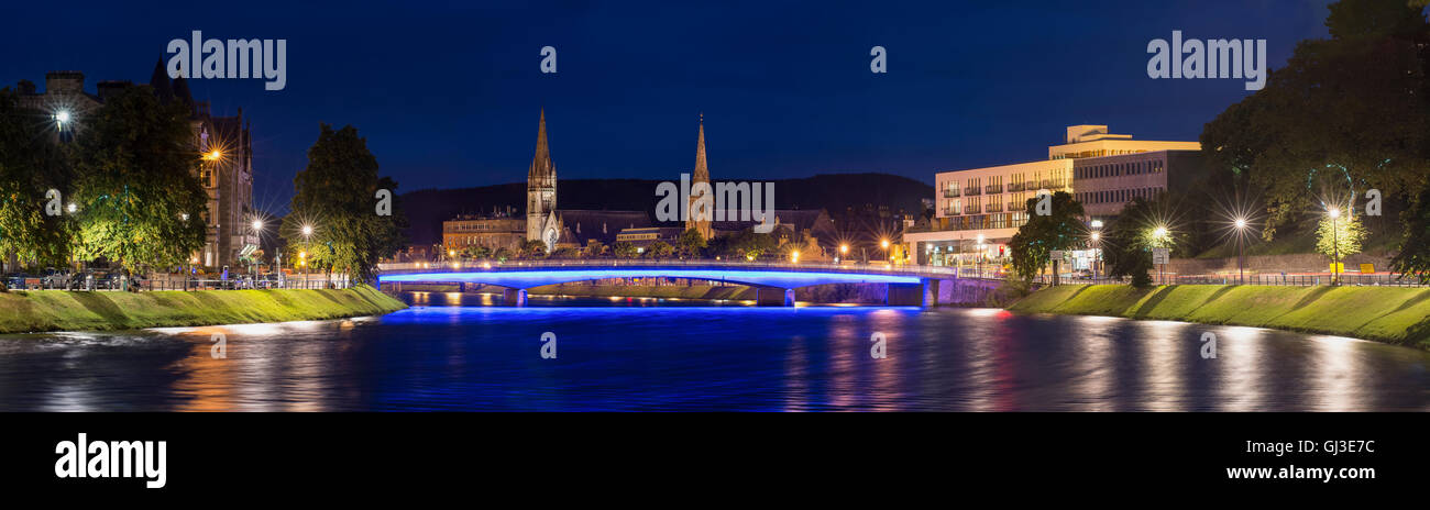 The city of Inverness at night with the bridge lit by blue lights Stock Photo