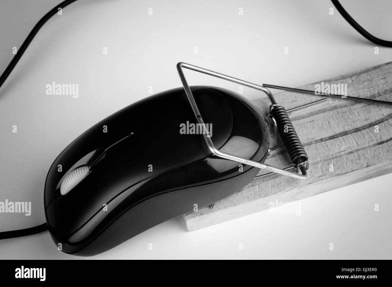 Computer mouse in a trap, a e commerce and computer addiction concept