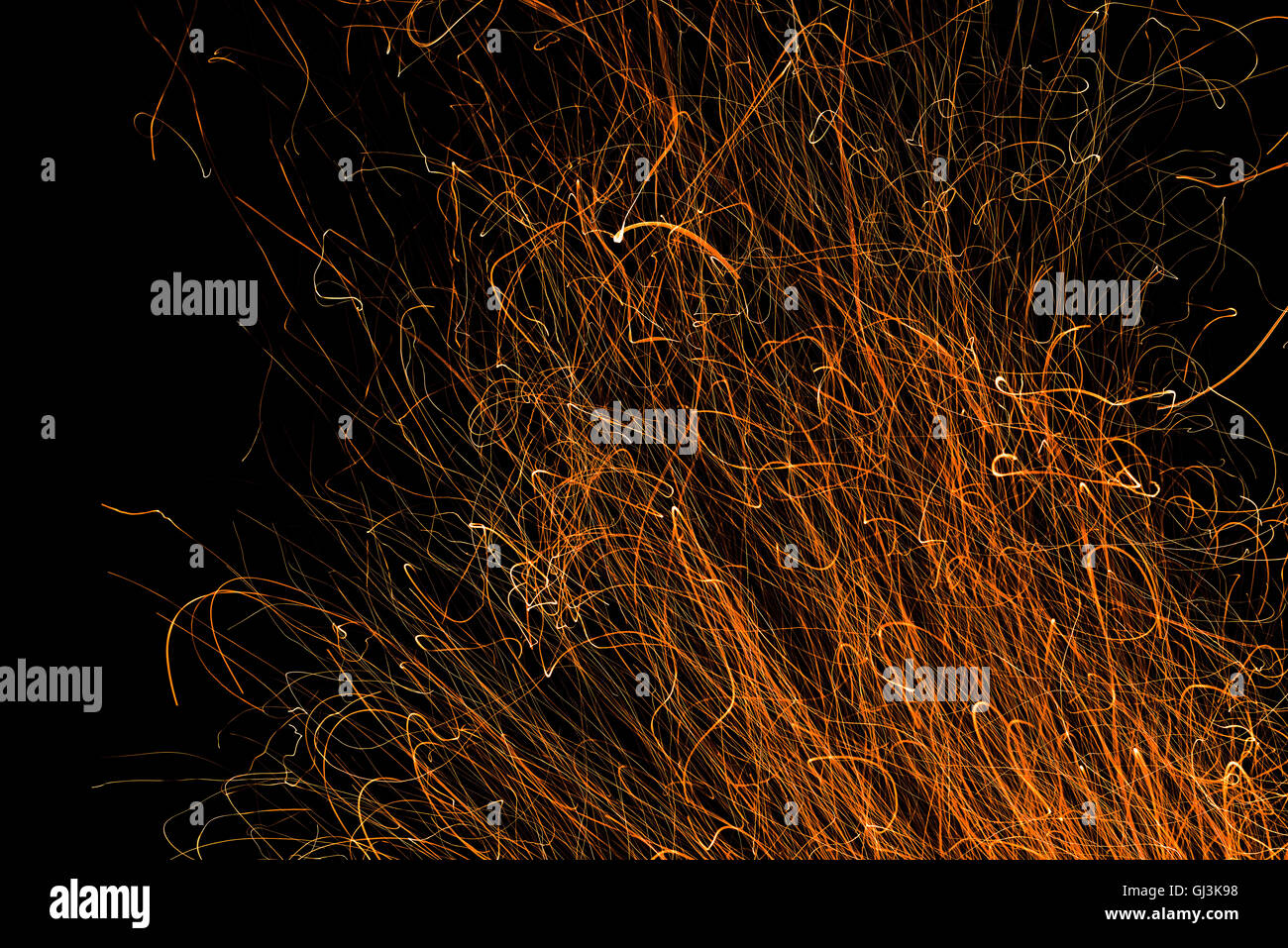 Dancing flames and sparks isolated on black Stock Photo - Alamy