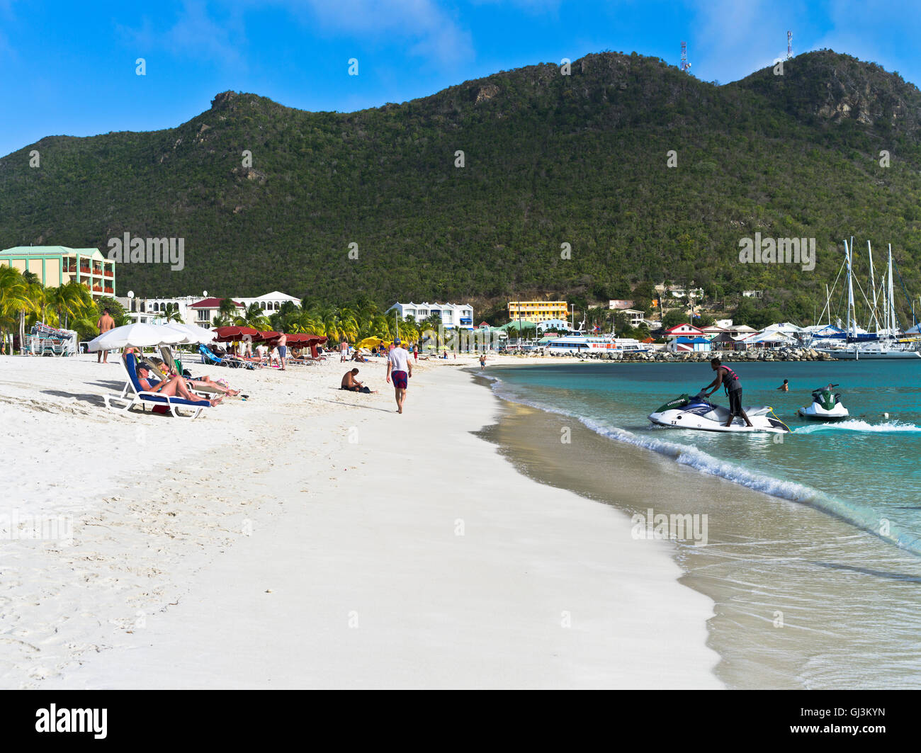 dh Philipsburg ST MAARTEN CARIBBEAN White sand beach sunbathers sun loungers jet skiier Stock Photo