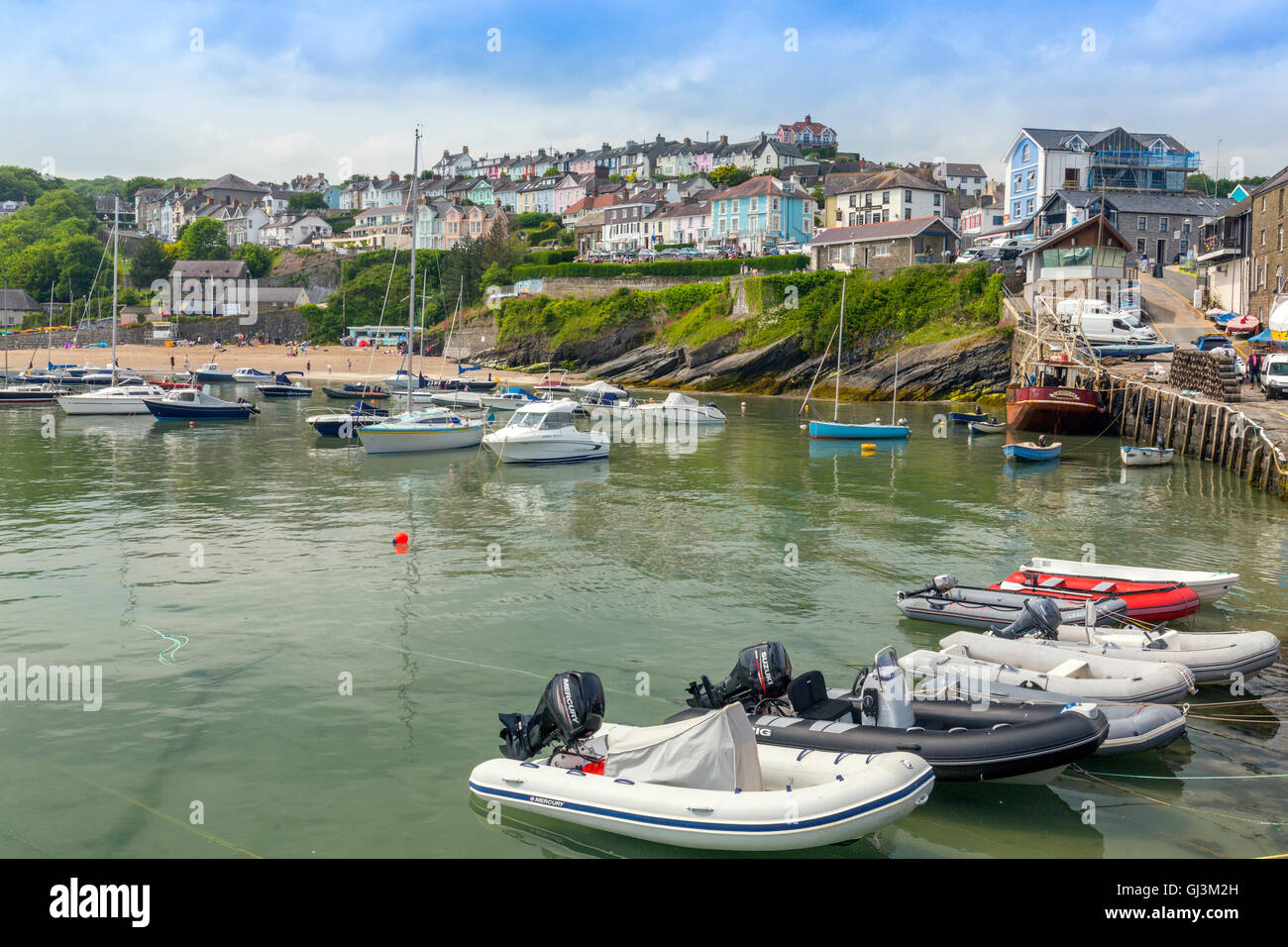 Rows of colourful houses overlook the harbour in New Quay, Ceredigion ...