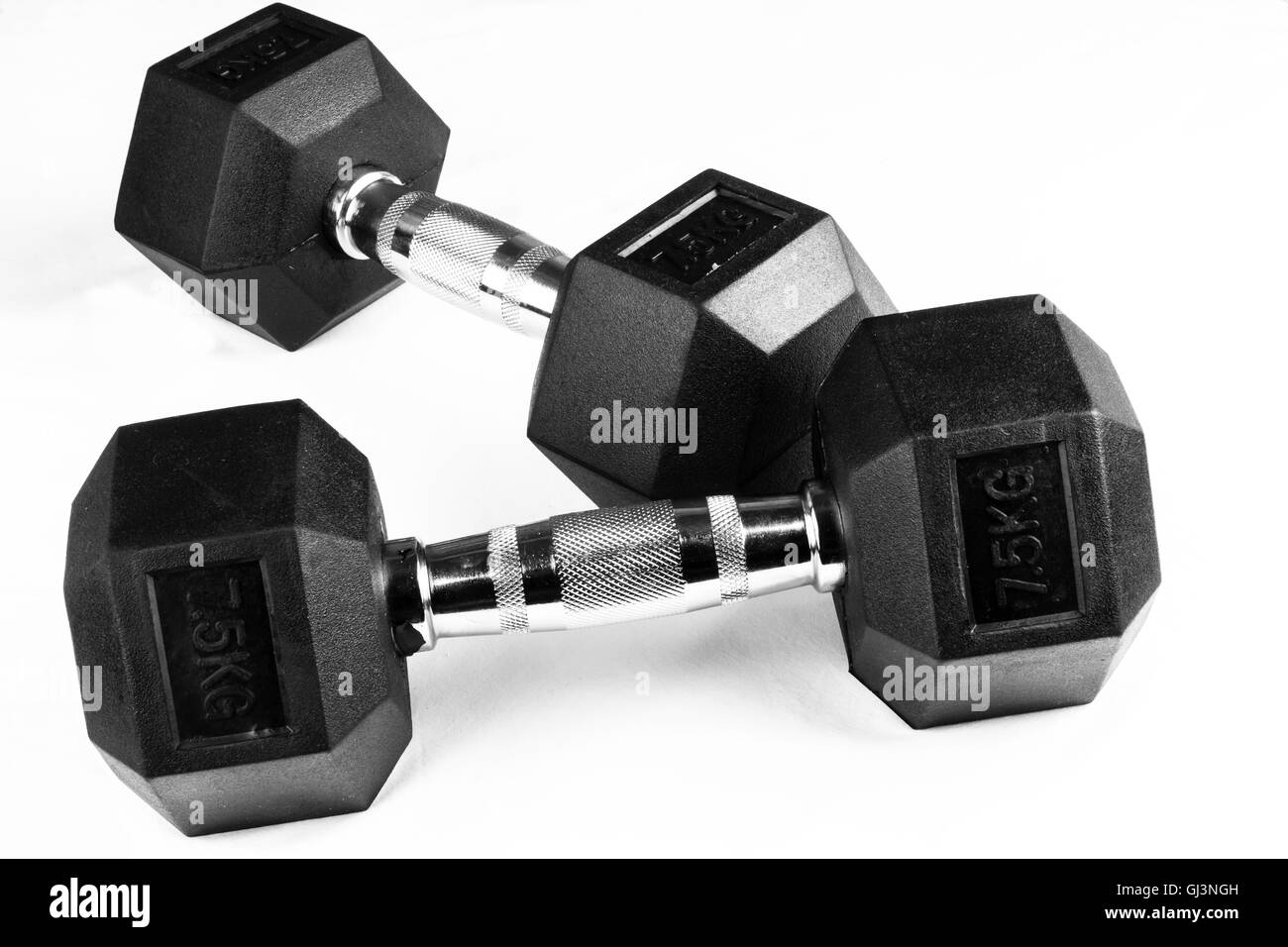 Two 7.5kg dumb-bells black with chrome handles on white background Stock Photo
