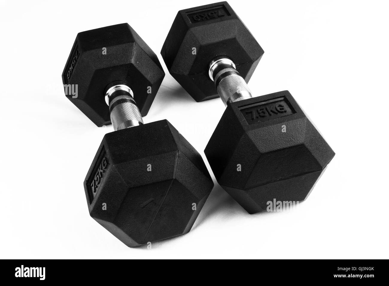 Two 7.5kg dumb-bells black with chrome handles on white background Stock Photo